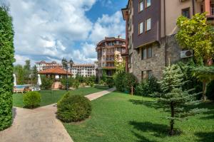 a park in a city with a building at South Beach Hotel - New Management and Free Beach Access in Tsarevo
