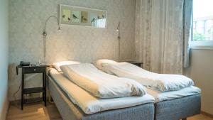 Ein Bett oder Betten in einem Zimmer der Unterkunft Almaas Hotell Stord AS