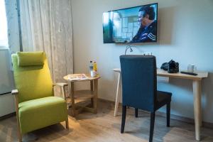 TV/Unterhaltungsangebot in der Unterkunft Almaas Hotell Stord AS