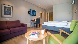 TV/Unterhaltungsangebot in der Unterkunft Almaas Hotell Stord AS