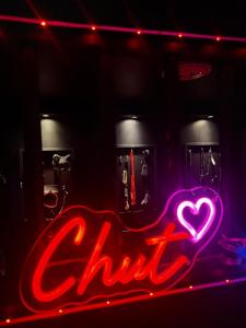 a neon sign with a heart in the dark at Love room location de 15h a 17h in Wattignies