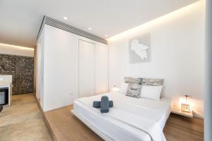 Ένα ή περισσότερα κρεβάτια σε δωμάτιο στο Relux Ios Hotel
