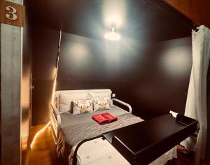 a small room with a bed and a table at Start House 5 mins walk Airport in Ho Chi Minh City +12 photos