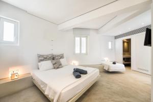 Ένα ή περισσότερα κρεβάτια σε δωμάτιο στο Relux Ios Hotel