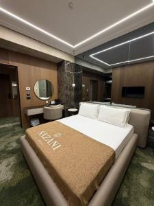 Postelja oz. postelje v sobi nastanitve Sazani Hotel