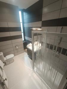 a bathroom with a sink and a toilet in it at Chambre D’hôtes Parc Johan in Chauffailles +44 photos