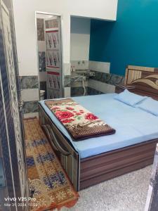 a bed in a room with a mattress sidx sidx sidx at RK Residency in Ayodhya