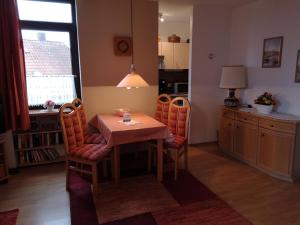 a dining room table and chairs in a kitchen at Lindenhof Wohnung 19 in Dahme