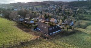an aerial view of a large house in a field at Eldon Lea in Strathpeffer