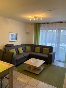 a living room with a couch and a coffee table at Saarstrasse 18h in Dahme