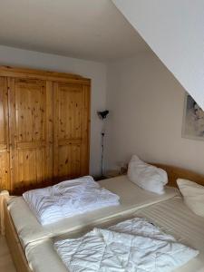 a bedroom with a bed in a room at Saarstrasse 18h in Dahme