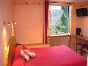 Postel nebo postele na pokoji v ubytování L'Auberge Campagnarde