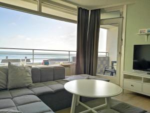 a living room with a couch and a table at Strandhotel Wohnung 31 in Dahme