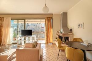 a living room with a couch and a table at 3BD Apartment in the Center - Self check in in Patra
