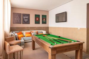 a living room with a pool table and a couch at Smala Beldi Guest House in Essaouira