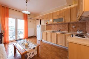 Kuchyň nebo kuchyňský kout v ubytování Peramos Apartments