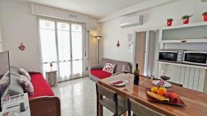 a living room with a couch and a table at Sweetheart Apartment in Busto Arsizio