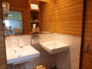 a bathroom with two sinks and a mirror at Inn Azur in Yamatotakada +52 photos