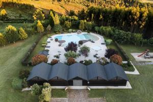 an aerial view of a garden with a swimming pool at Refúgio das Velhas in Vila Nova de Cerveira