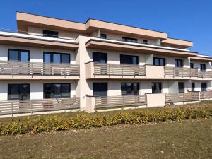 a building with balconies on the side of it at Penthouse-Villa Natura in Hegykő