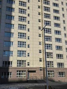 a large building with a street light in front of it at shunshig 11 in Ulaanbaatar