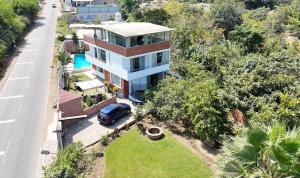 an aerial view of a house with a car parked in the driveway at El Sol de Simbal in Trujillo