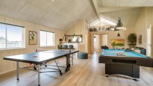 a room with two ping pong tables in it at Villavilla 451 - Grenå Strand, Østjylland in Grenå