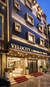 a building with a sign on the front of it at Velocity Corporate Hotel TERMINAL 2,3 Delhi Airport With- Free Airport Pickup in New Delhi