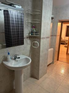 a bathroom with a sink and a mirror at Casa Marisol in Arrabal de Portillo +19 photos