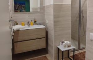 a bathroom with a sink and a shower at Il Loft di Pieve in Città della Pieve +29 photos