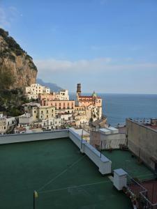 a group of buildings on a hill next to the ocean at Dany House in Atrani