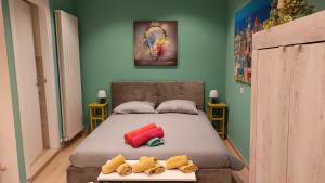 a bedroom with a bed with two towels on it at Il Loft di Pieve in Città della Pieve