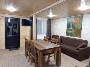 a living room with a table and a couch at Sno Valley Cottage in Sno