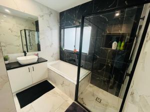 a bathroom with a shower and a sink at My Home II in Tarneit