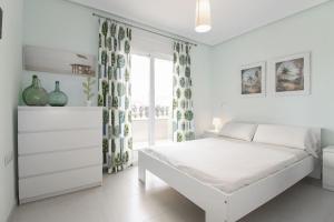 A bed or beds in a room at Brisa del Mar Még 37 kép
