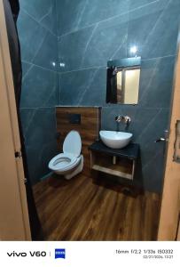a bathroom with a toilet and a sink at HR King HOTEL in Amritsar