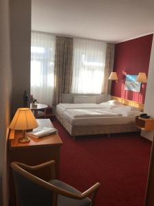 Postel nebo postele na pokoji v ubytování Hotel Waldperle
