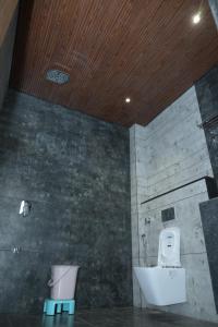 a bathroom with a toilet and a sink at Shree Shankar Paradise in Pharod