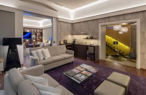 a living room with a couch and a table at Swiss Luxury Apartments Geneva - Serviced Apartments in Geneva