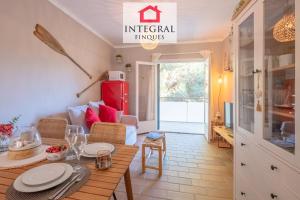 a living room with a table and a couch at El Secret de la Fosca in Palamós
