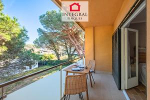 a balcony with a table and chairs on it at El Secret de la Fosca in Palamós