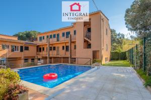 an image of a swimming pool in front of a building at El Secret de la Fosca in Palamós