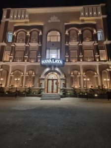 a large building with a sign on the front of it at Navalaya in Ludhiana
