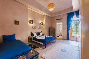 a bedroom with a bed and a window at Dar Kamango - Marrakech Peaceful Retreat in Marrakesh +69 photos