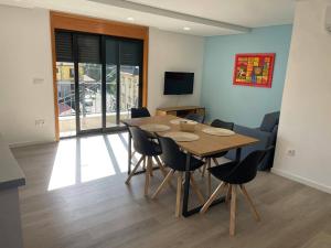 a dining room with a table and chairs at Gerês View in Geres