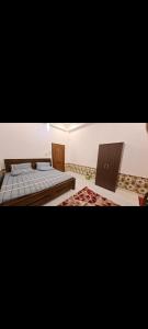 a room with two beds and a table at Imperial Royal Grand Hotel in Wennawatta