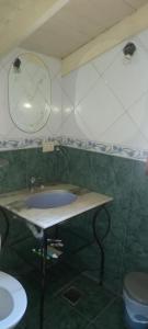 a bathroom with a sink and a toilet at Habitaciones Cecy in General Juan Madariaga +2 photos
