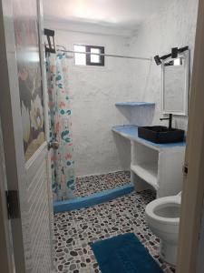 a bathroom with a toilet and a sink and a shower at Art rock garden in Ko Lipe +23 photos