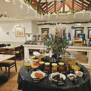 a table with food on it in a restaurant at The County Hotel in Carlisle