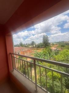 a room with a balcony with a view at Sefitel in Lubumbashi